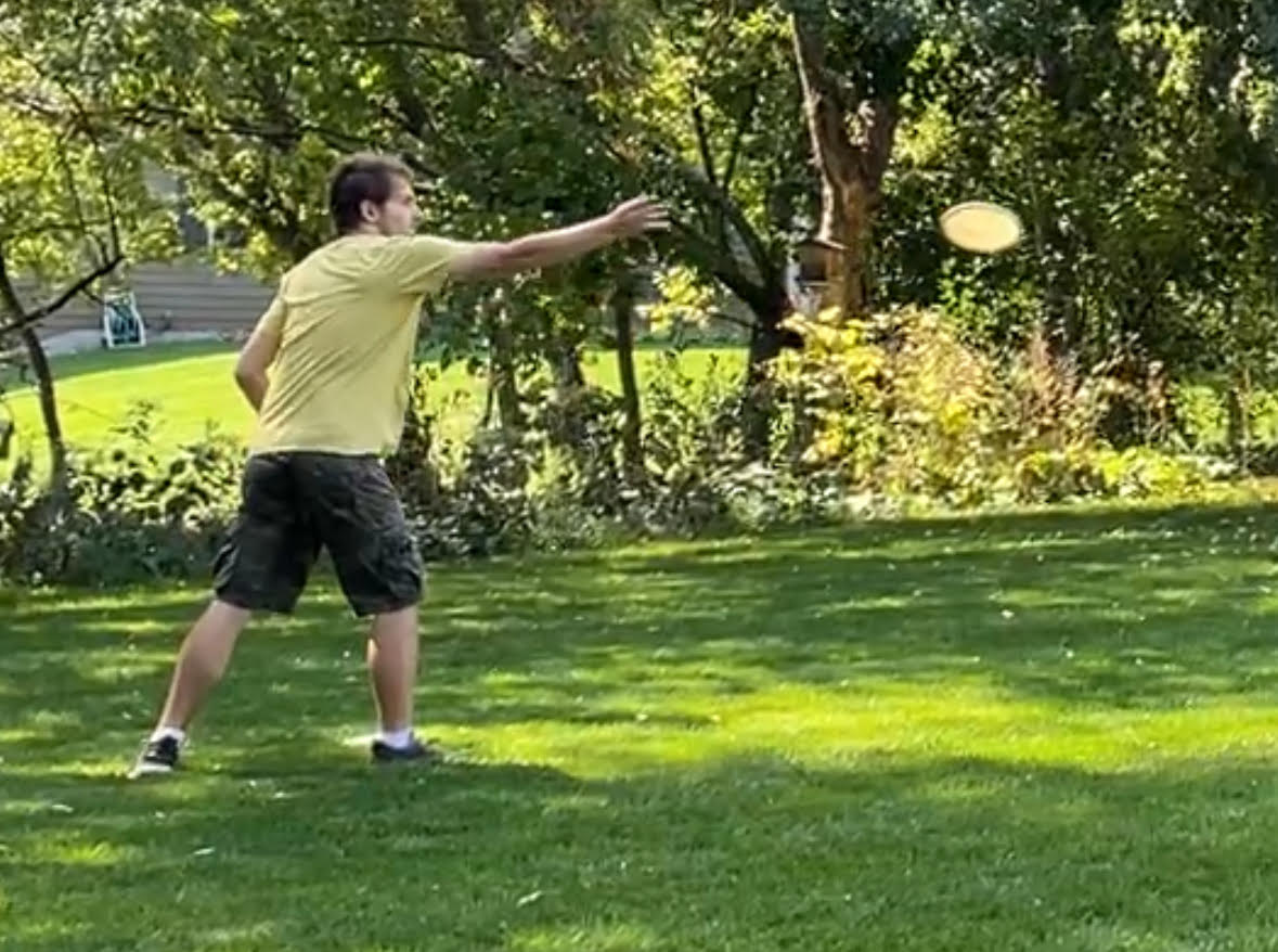 Me throwing a frisbee